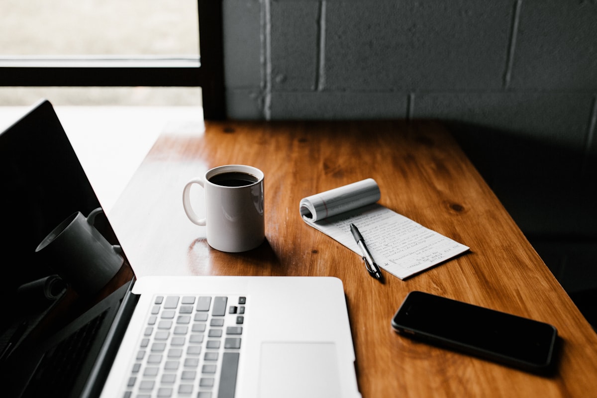 Writer at a laptop planning a blog post for search visibility